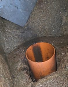Gap between a concrete manhole wall and a house sewer pipe, a common cause of rat infestation